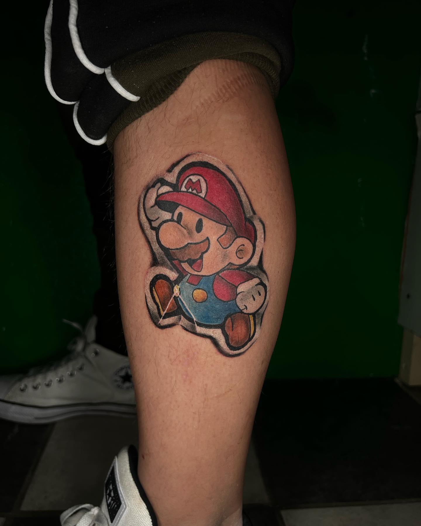 Mario new school tattoo on the forearm by Glen Wallis