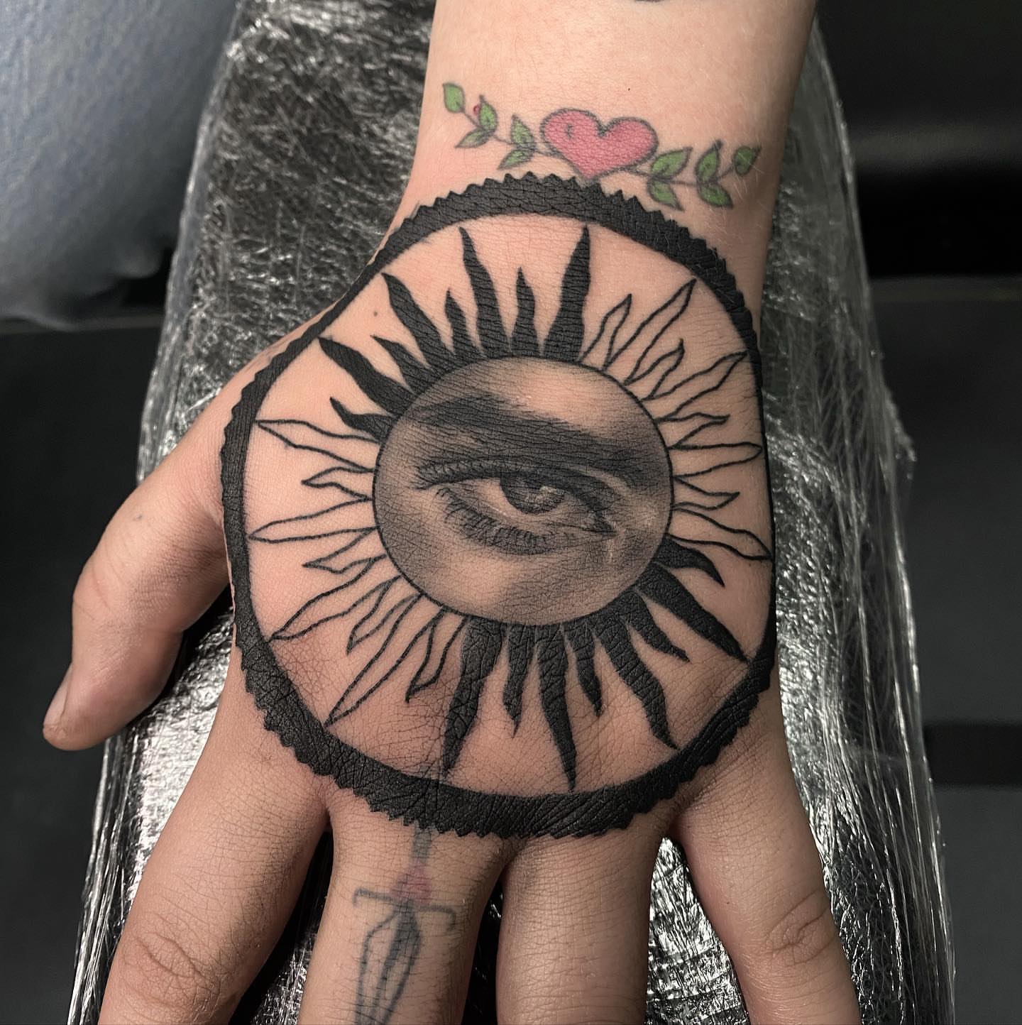 Eye within sun realism tattoo on the hand by Tattoosxjoseph