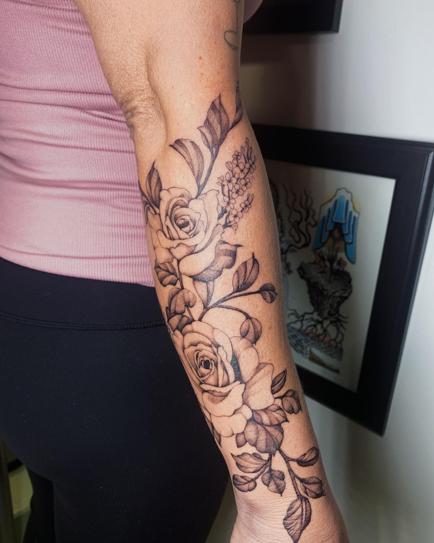 Roses black and grey tattoo on the forearm by Kolby