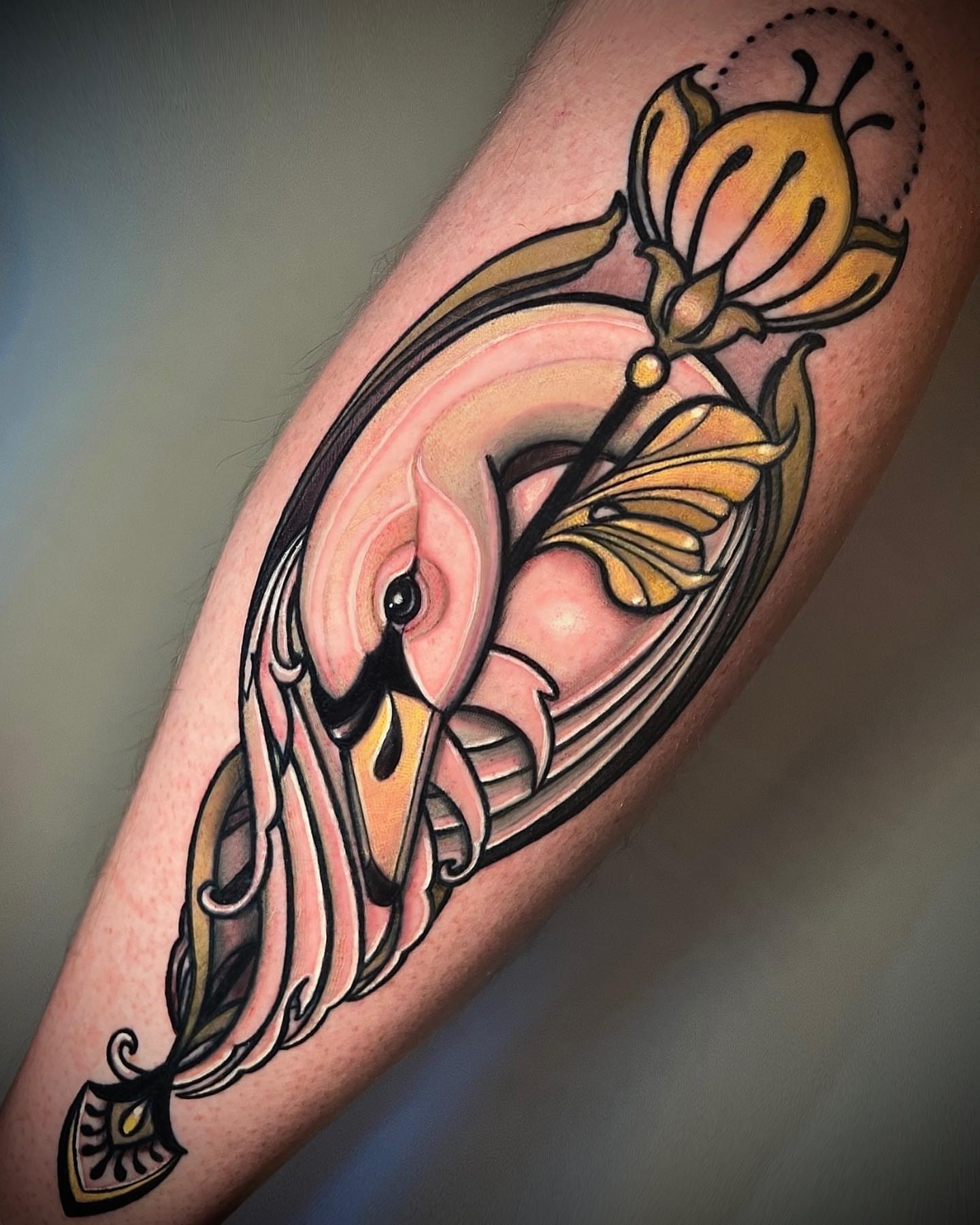 Bird and flower neo-traditional tattoo on the forearm by Cortney Norton