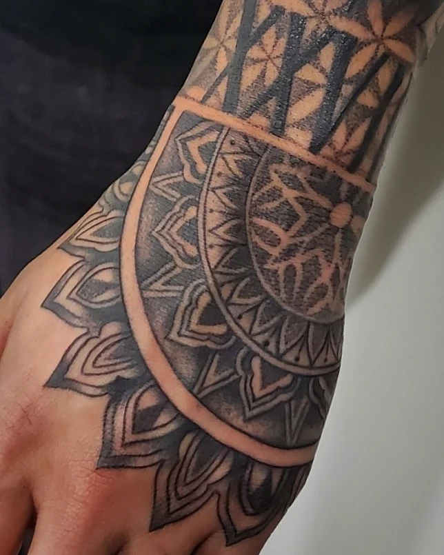 Mandala geometric tattoo on the forearm by William Gualteros