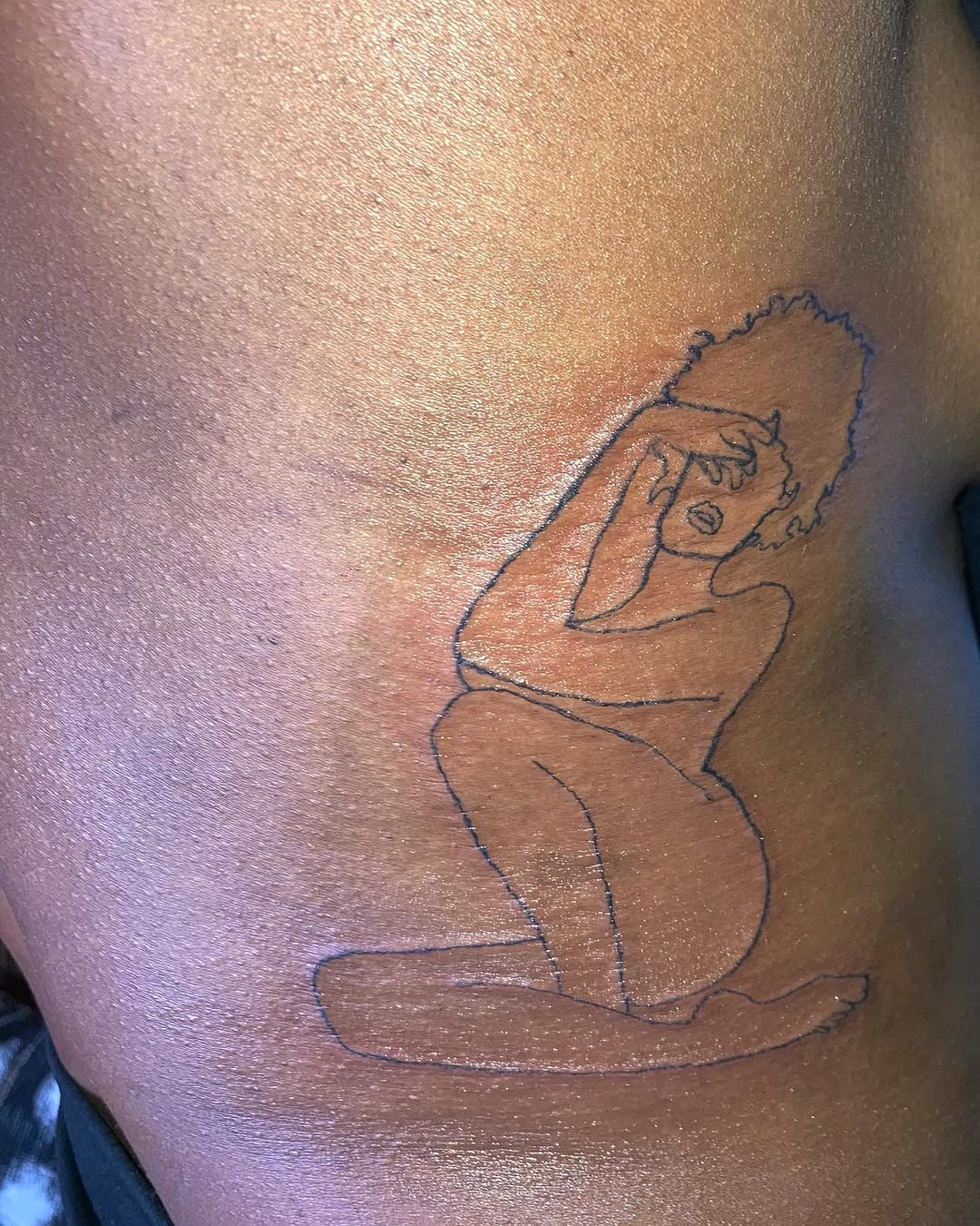 Woman sitting sketch tattoo on the back by CmoreInk