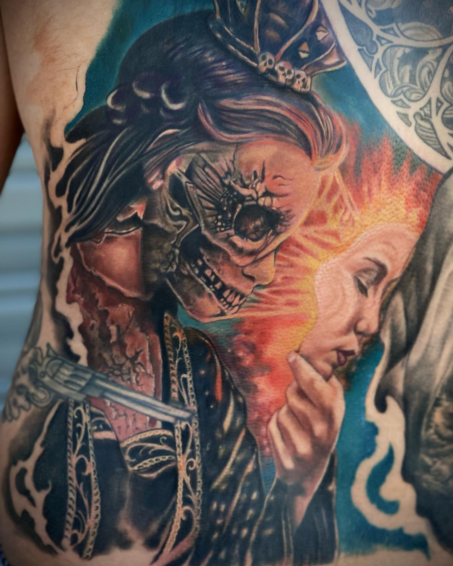 Skeleton and woman realism tattoo on the torso by Jerm Rekow