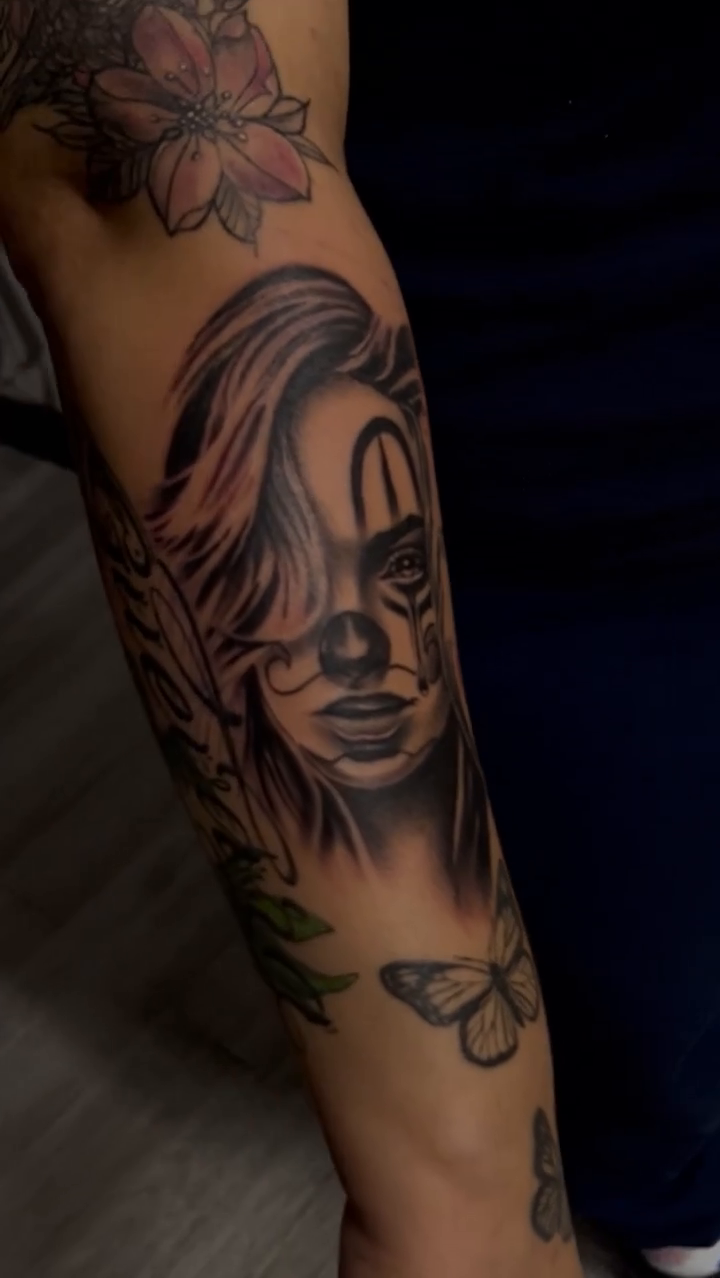 Woman with clown makeup realism tattoo by Moose