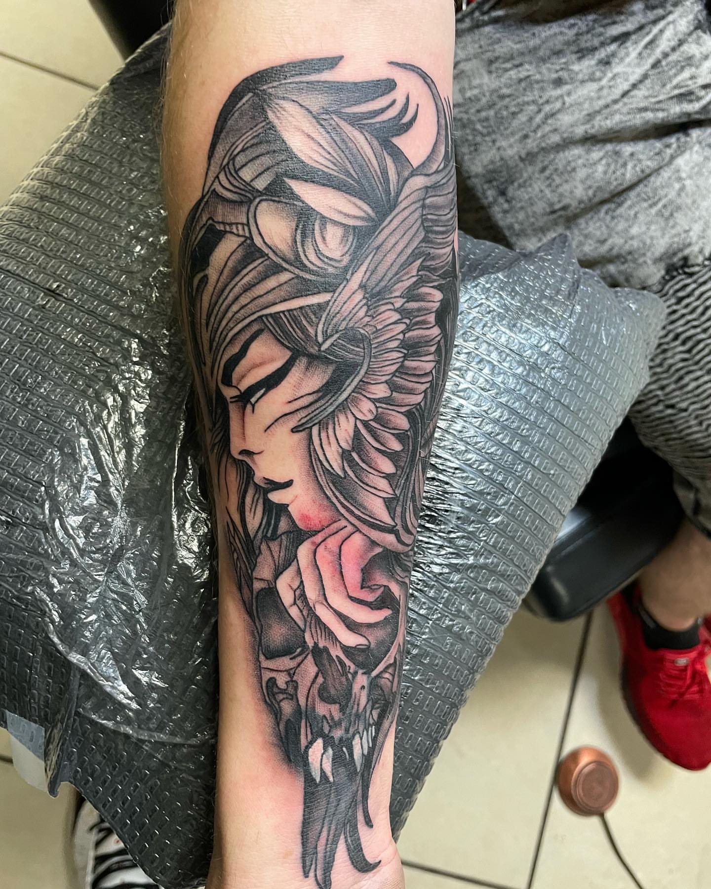 Woman with wings realism tattoo on the forearm by Las Vegas Tattoo Artist