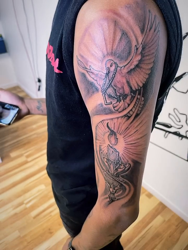 Candle with dove and rays realism tattoo by Eldaddy