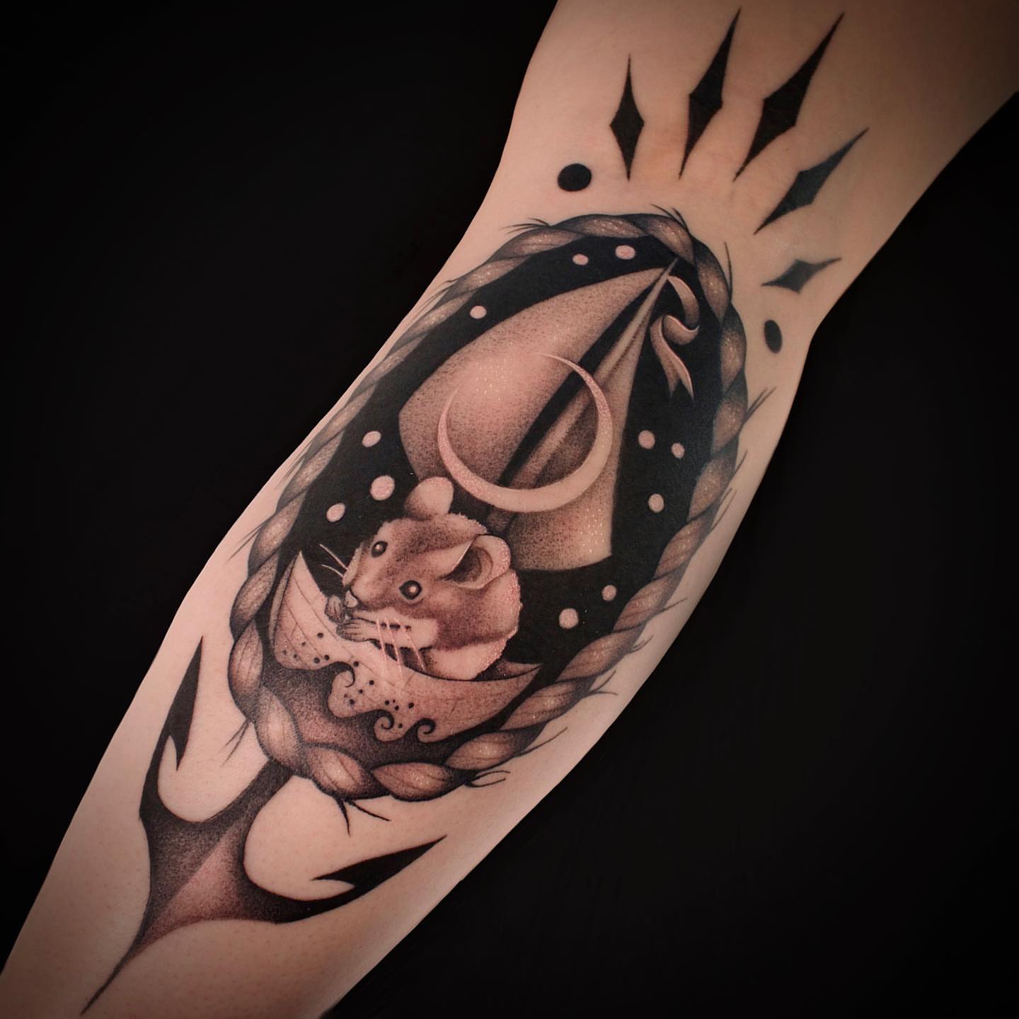 Cat in rope dotwork tattoo on the forearm by Galen