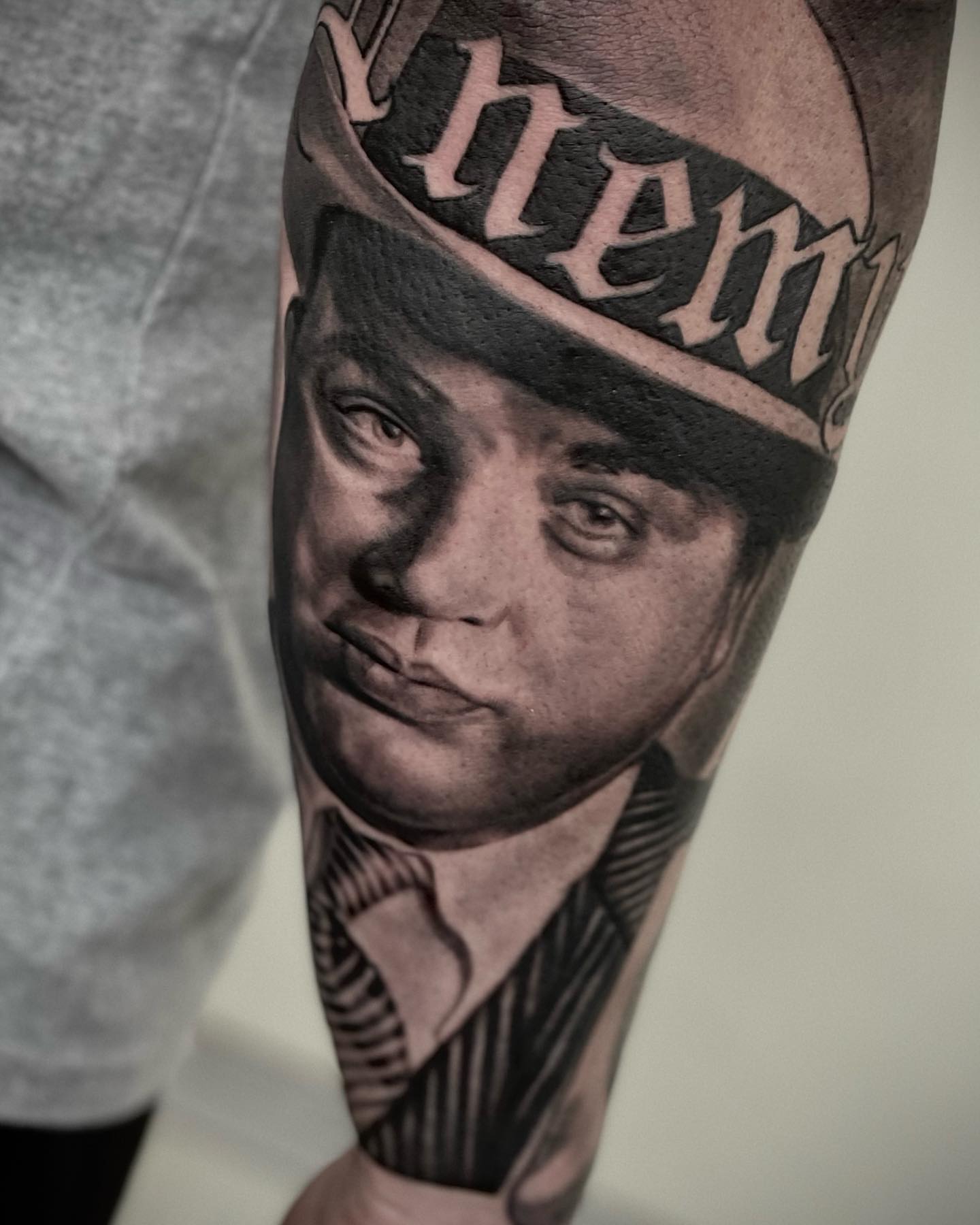 Portrait of a man realism tattoo on the forearm by Jerm Rekow