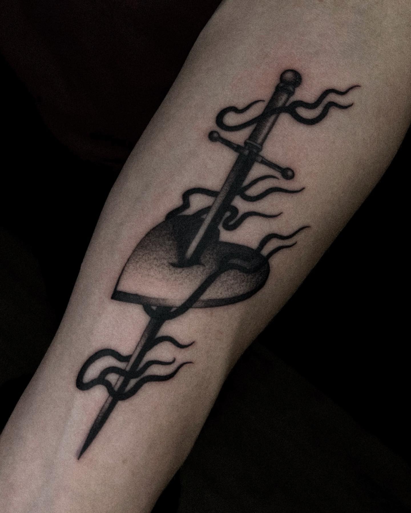 Sword and dragon black and grey tattoo on the forearm by David Ha