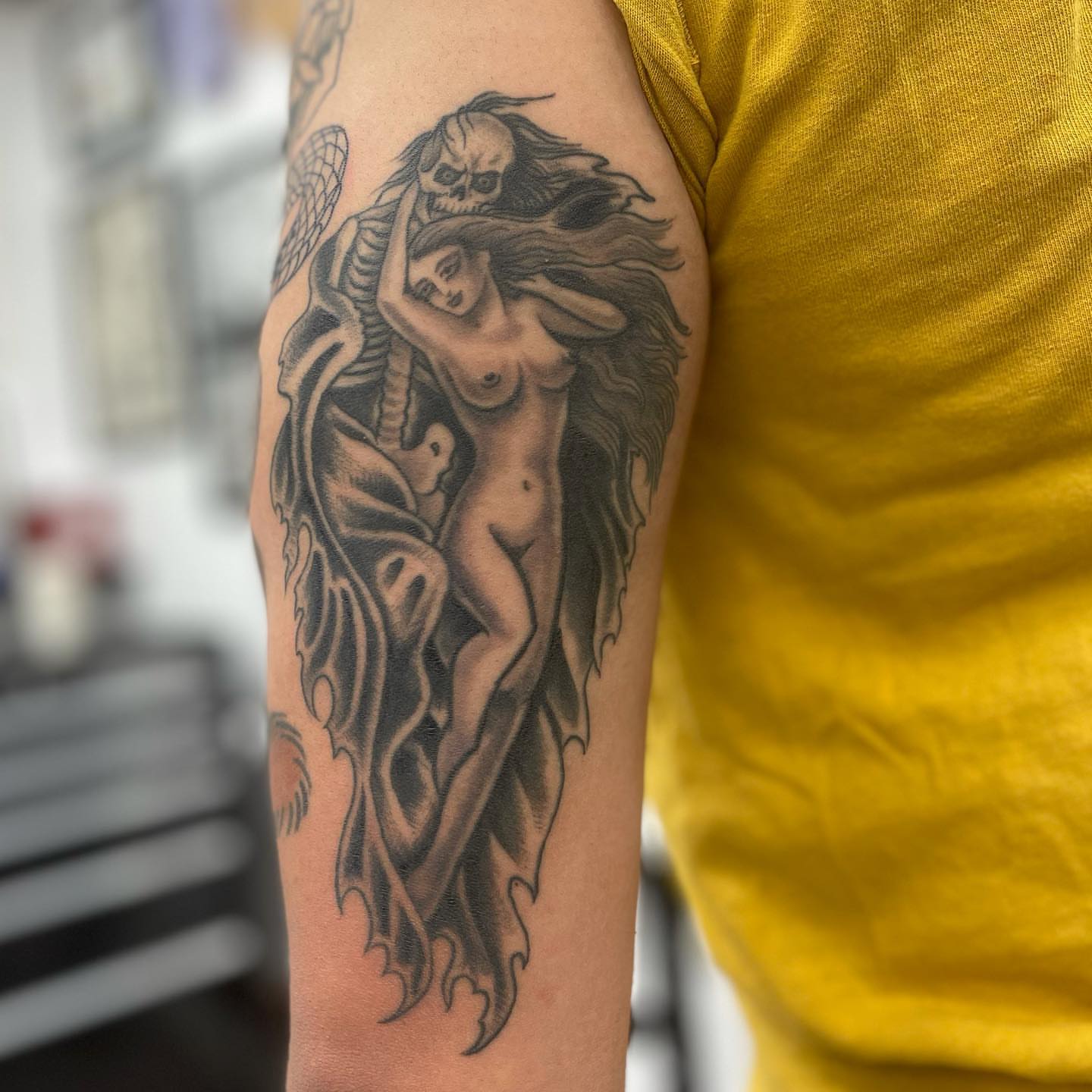 Naked woman with wings realism tattoo on the forearm by Mister Joe Joe Frisco Tattoo, San Francisco, California