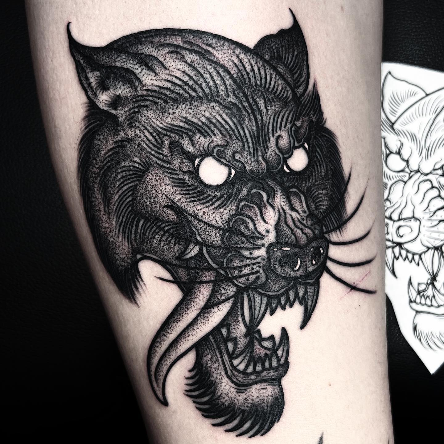 Wolf head dotwork tattoo on the forearm by Jared🗡Hughes