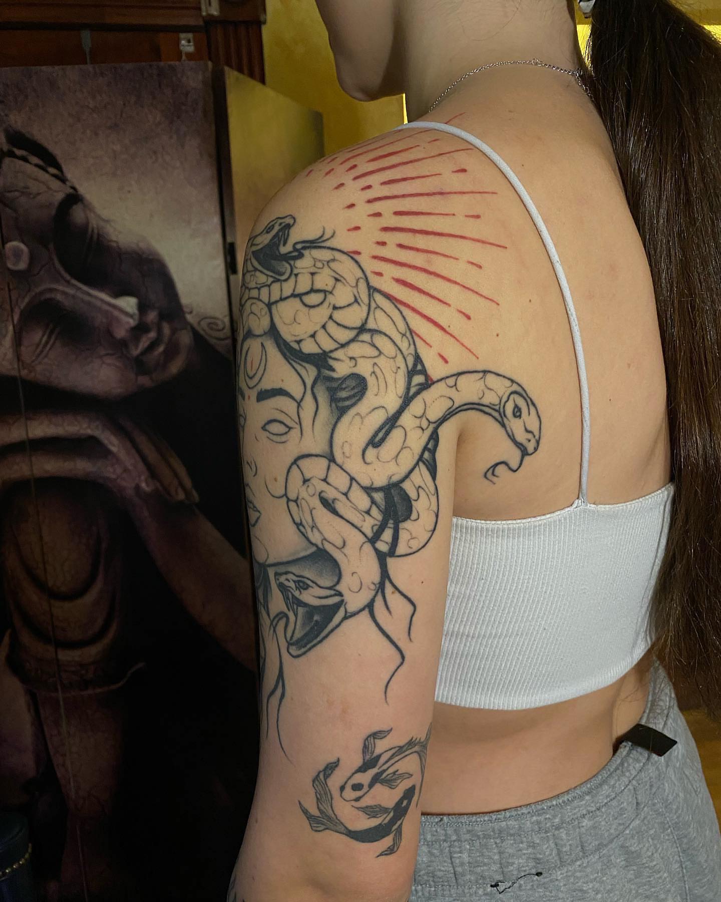 Snakes black and grey tattoo on the shoulder by Shamanic Ink