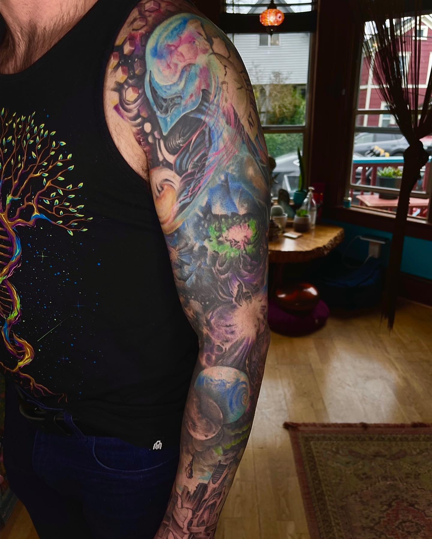 Space-themed biomechanical creature dotwork tattoo on the upper arm by Shamanic Ink