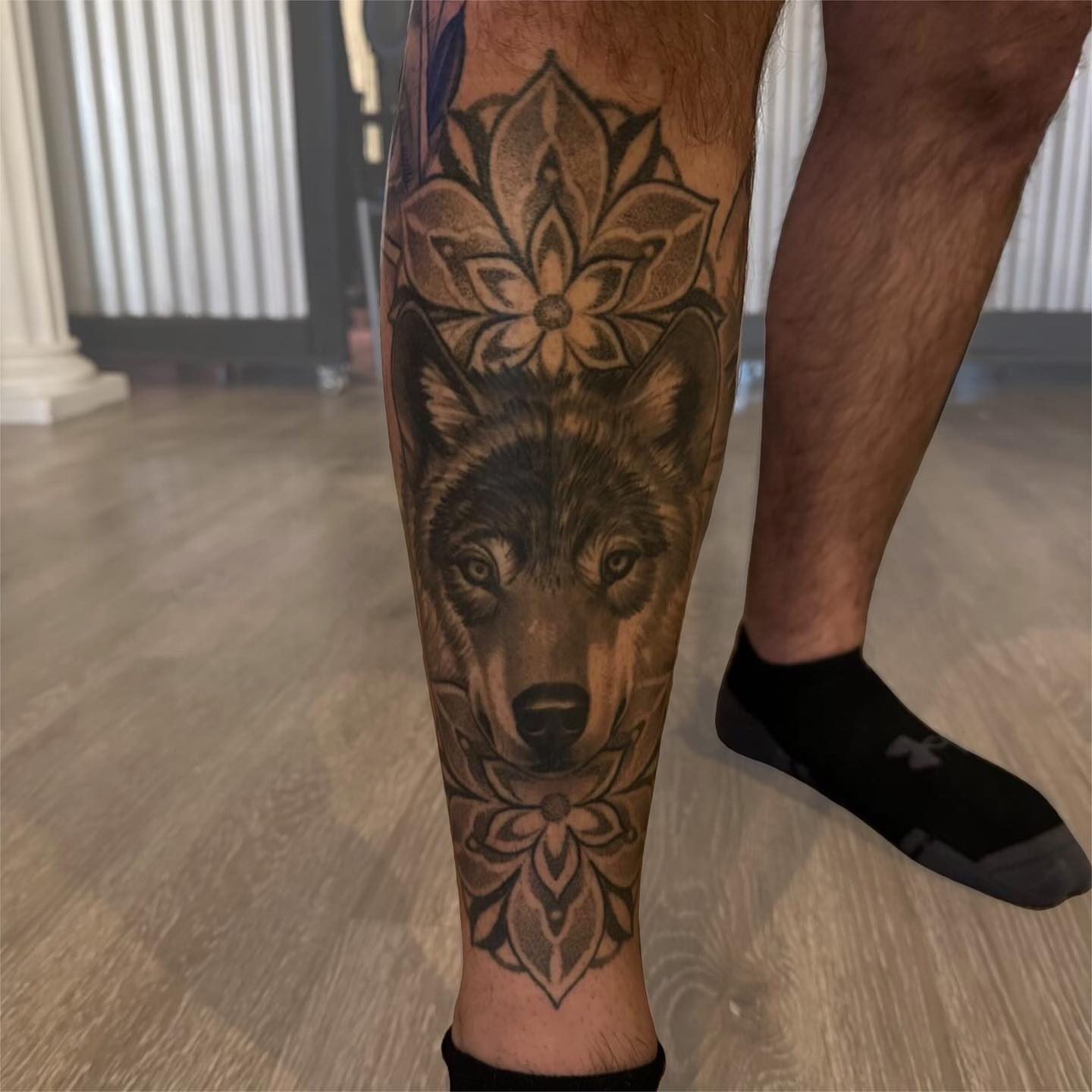 Wolf realism tattoo on the calf by Bill Johenning, Lakewood, Ohio