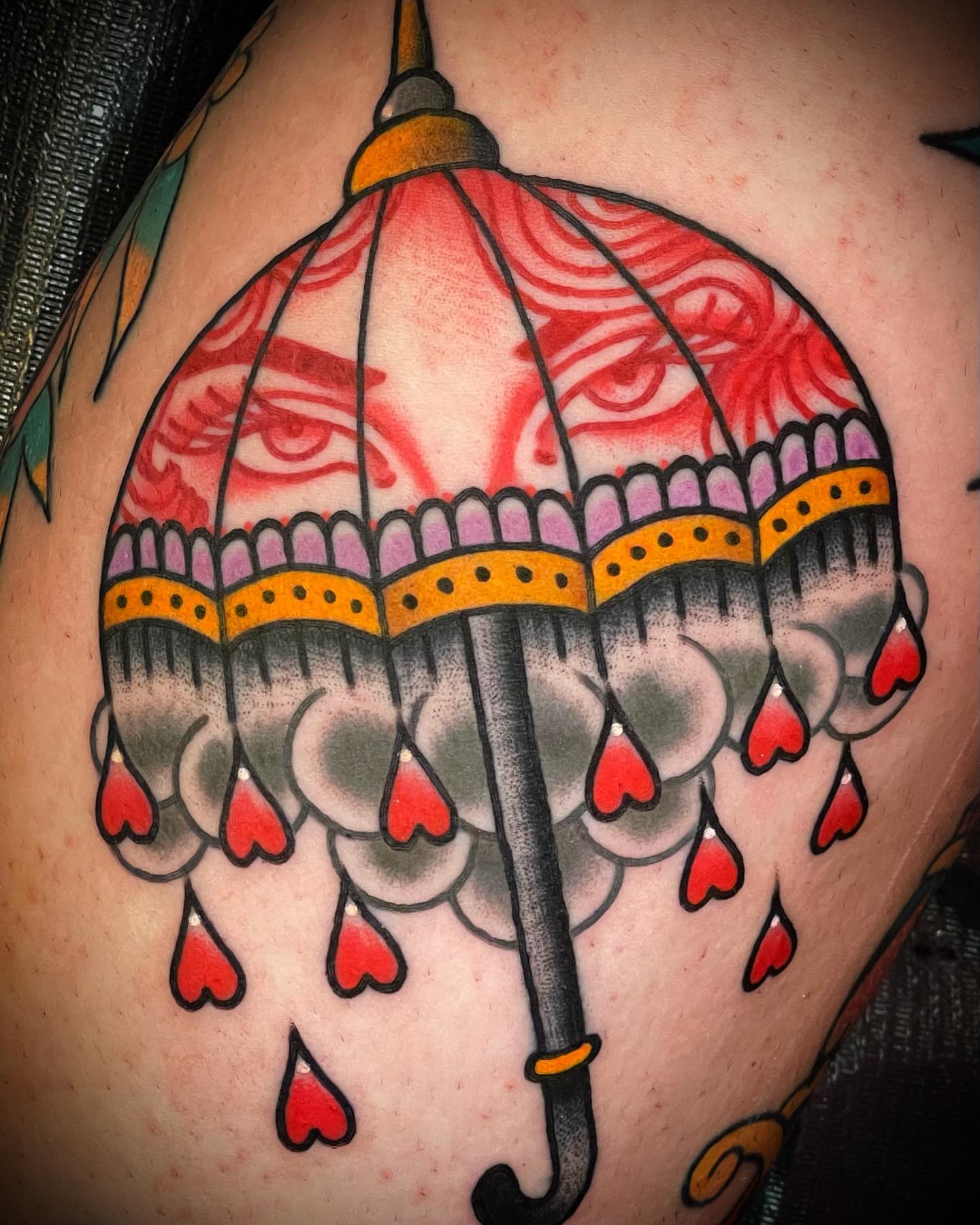 Umbrella with hearts American traditional tattoo on the shoulder by Alex Muniz