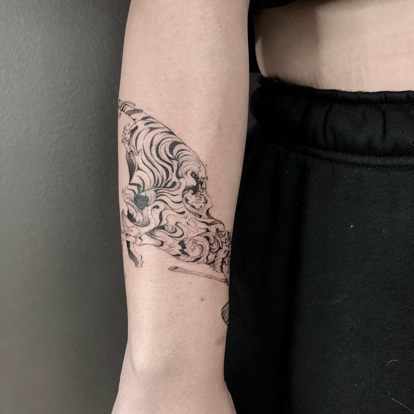 Unicorn black and grey tattoo on the forearm by Shihao zhao