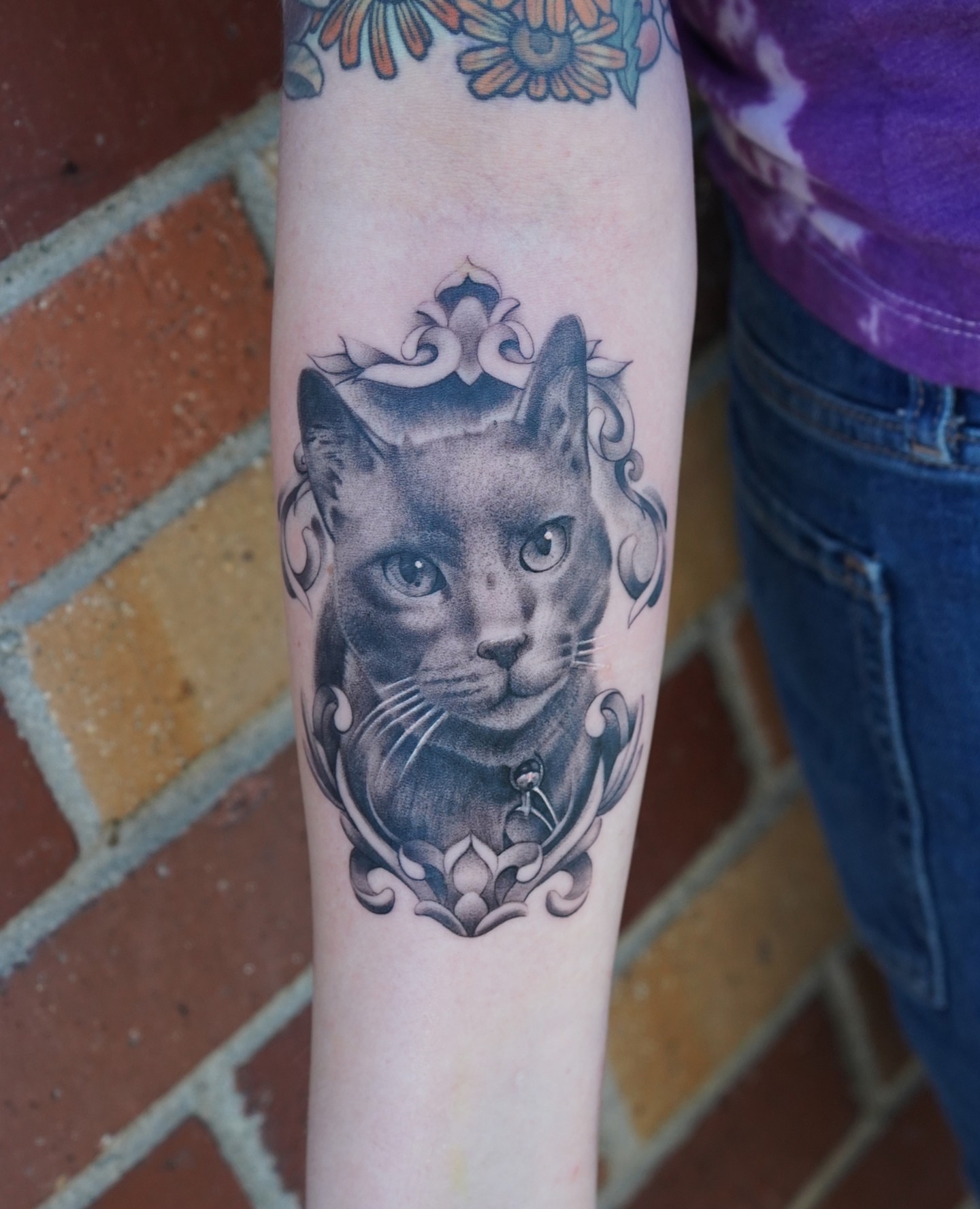 Cat realism tattoo on the forearm by Danny Madsen