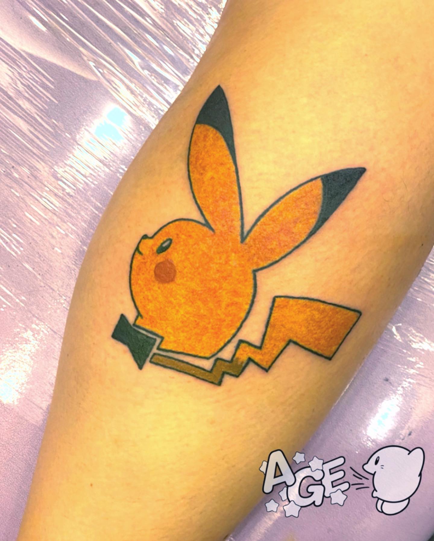 Playboy bunny new school tattoo on the forearm by Otaku and Gamer Tattooer