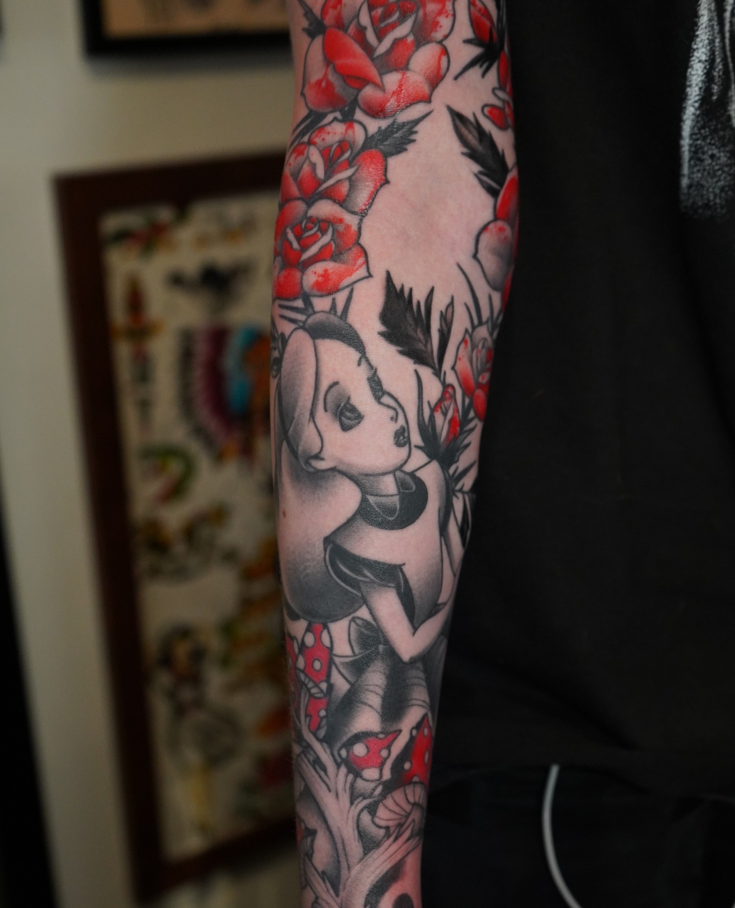 Woman with roses American traditional tattoo on the forearm by Danny Madsen