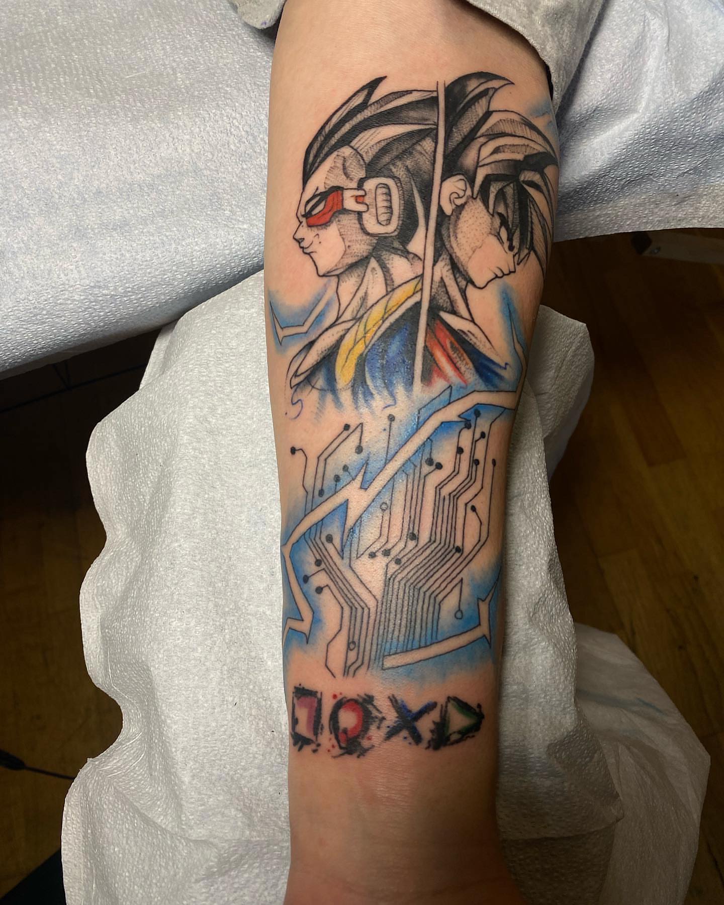 Cyborg character anime tattoo on the forearm by Shamanic Ink