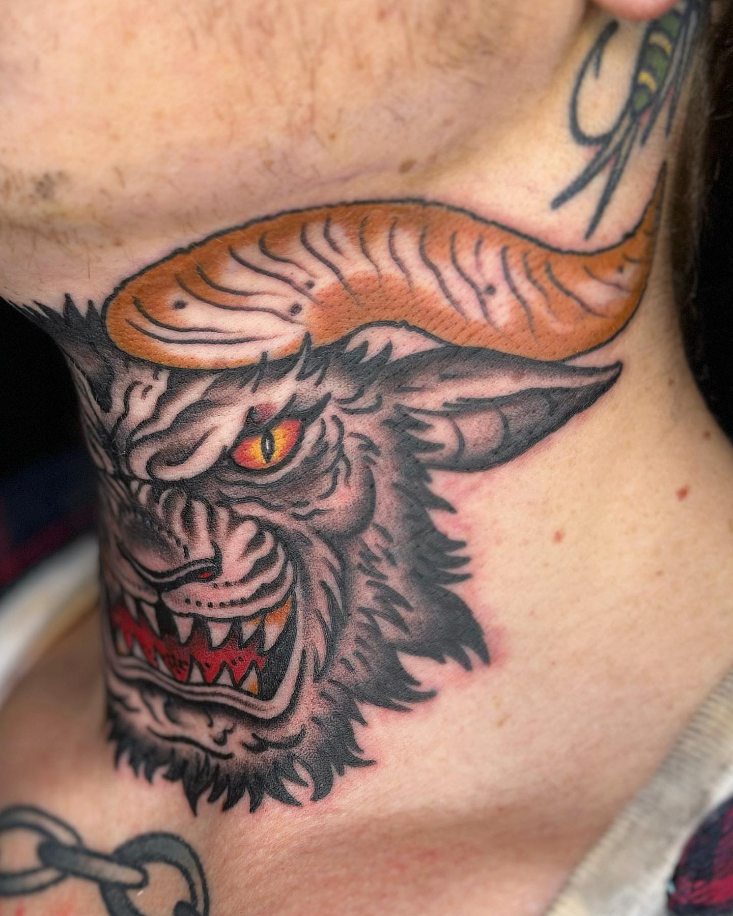 Demon head American traditional tattoo on the neck by Bryan Humphries