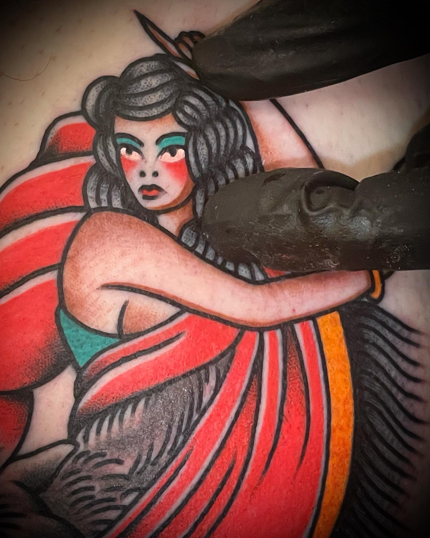 Woman with horse American traditional tattoo on the torso by Alex Muniz