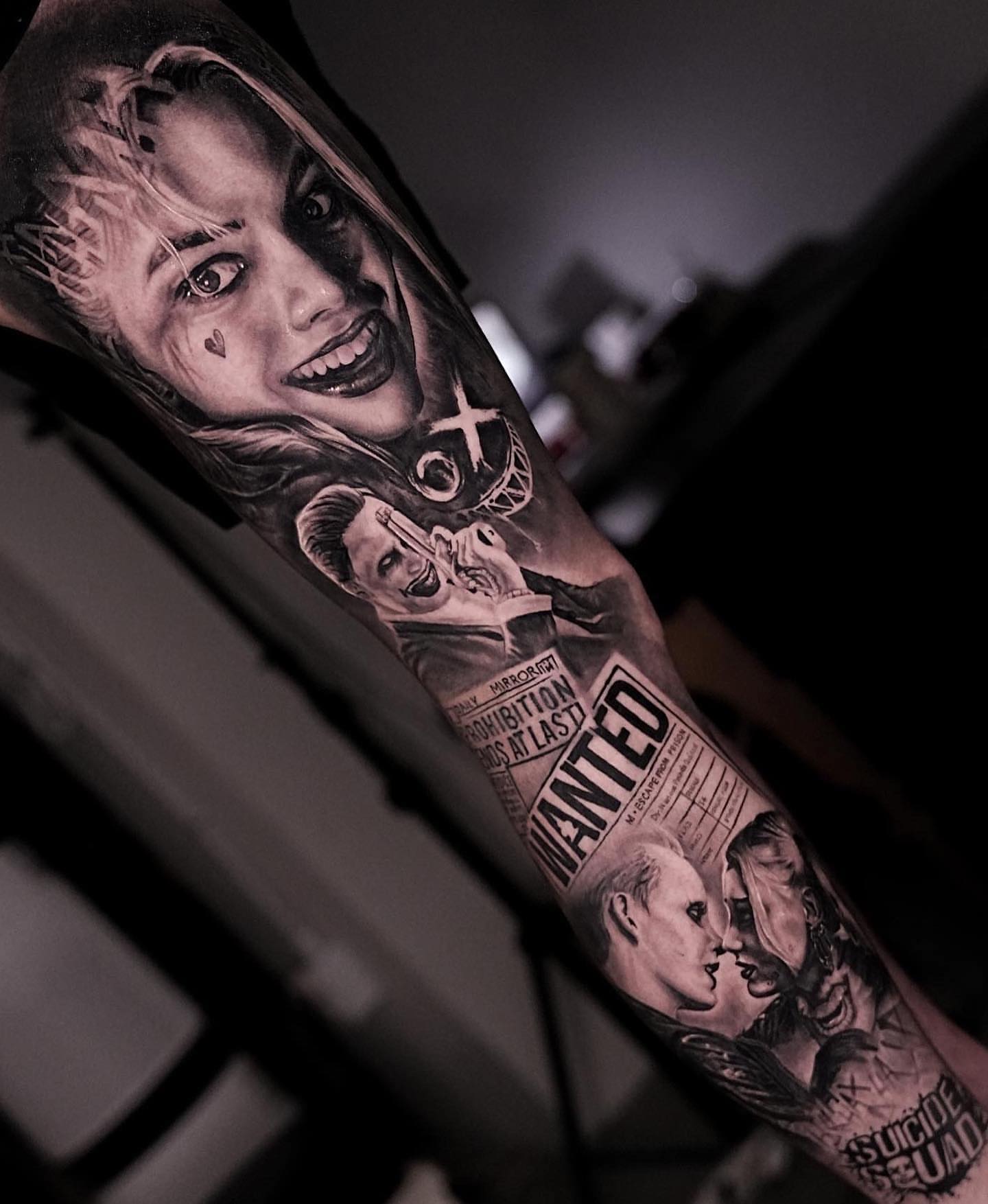 Joker character realism tattoo on the forearm by Black and Grey Tattoo Artist Umzii