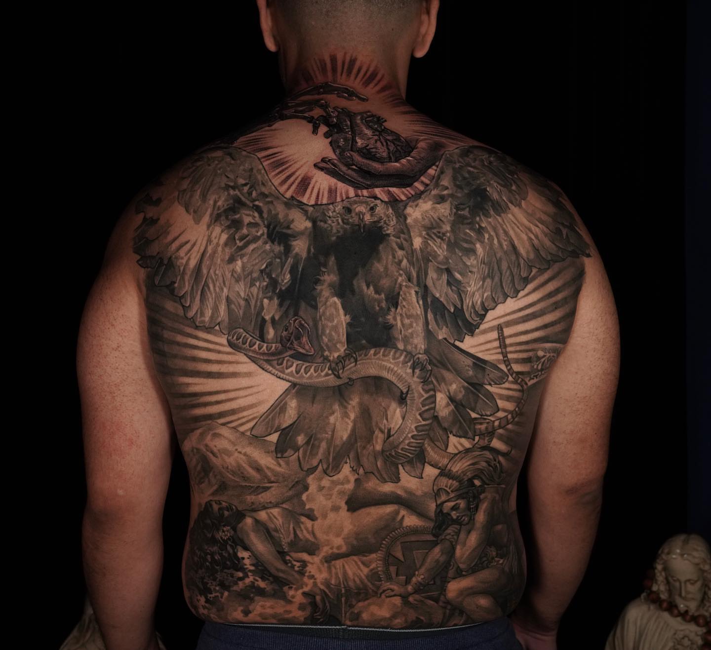 Mythical creature realism tattoo on the back by Brian Hernandez