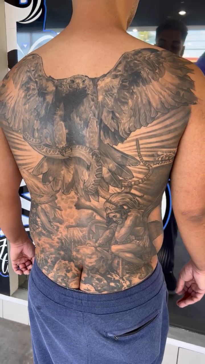 Angelic scene with anatomical heart realism tattoo by Brian Hernandez