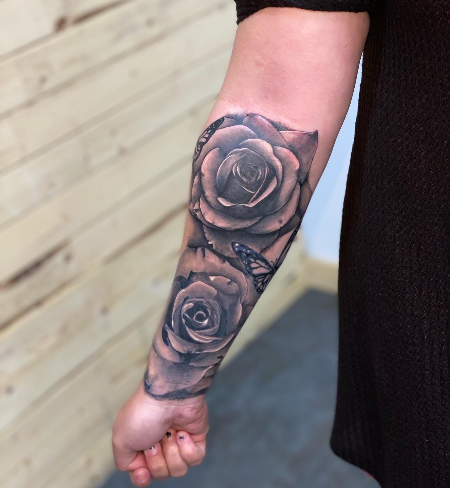 Roses realism tattoo on the forearm by Zach Ashton