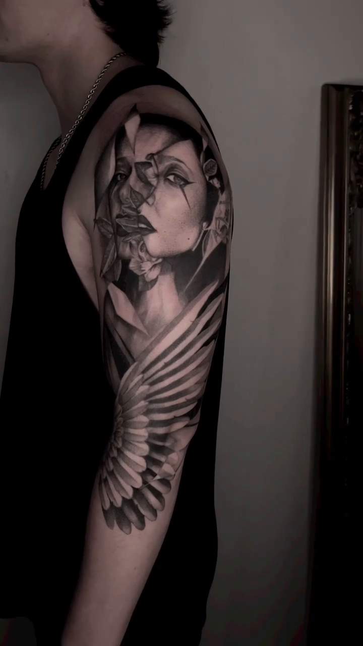 Woman with wings realism tattoo by Paige Jean