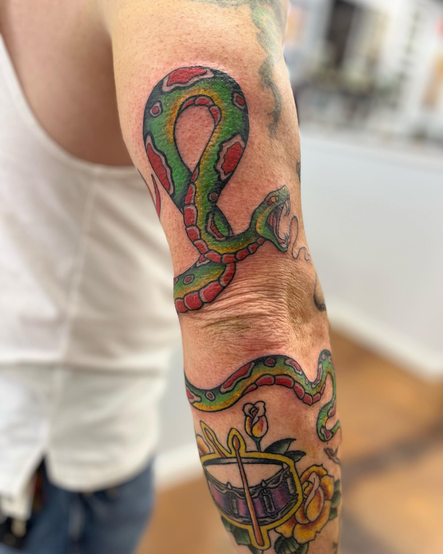 Snake American traditional tattoo on the forearm by Allie Tippets, Gilbert, Arizona