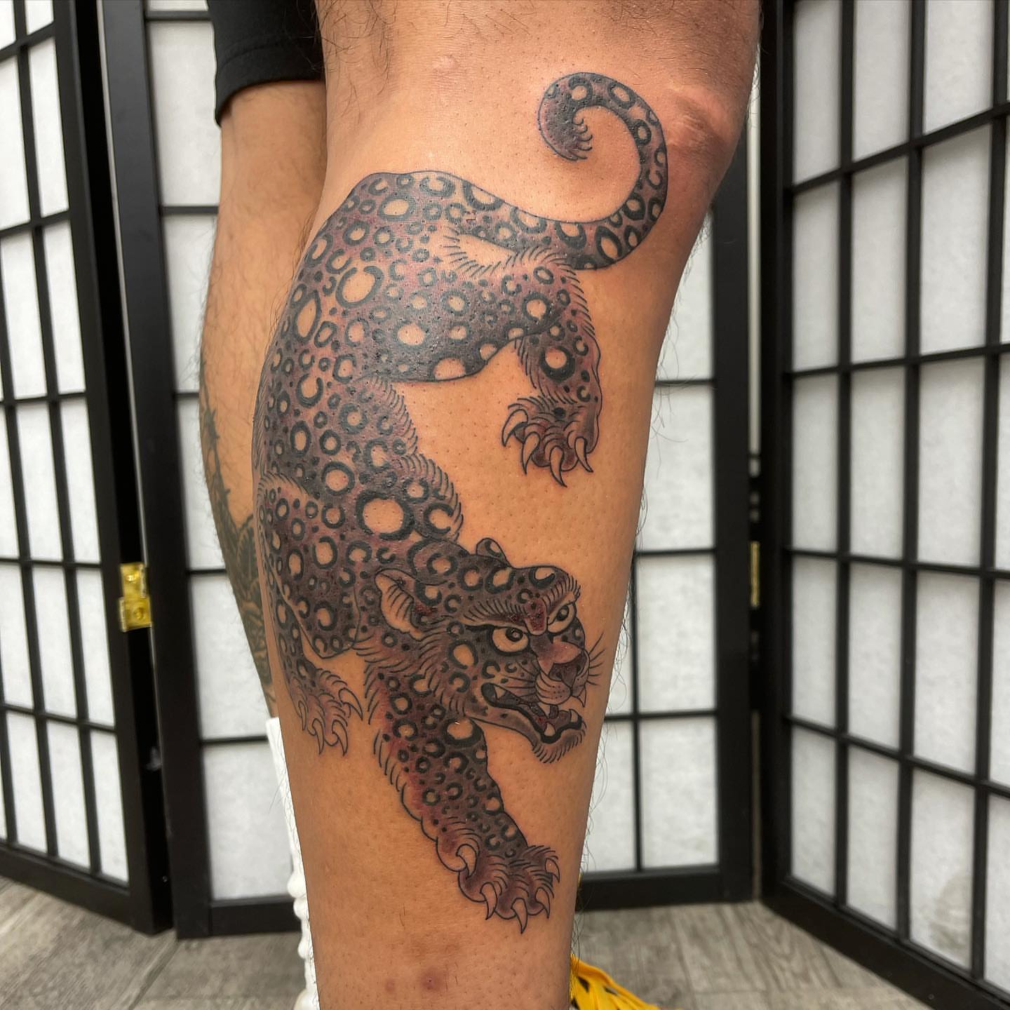 Leopard black and grey tattoo on the leg by Mister Joe Joe Frisco Tattoo, San Francisco, California