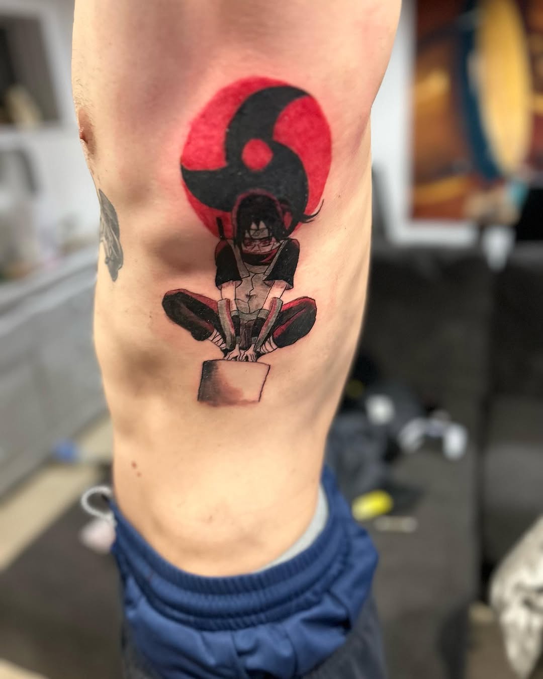 Itachi Uchiha from Naruto anime tattoo on the forearm by Daniel Monyongo