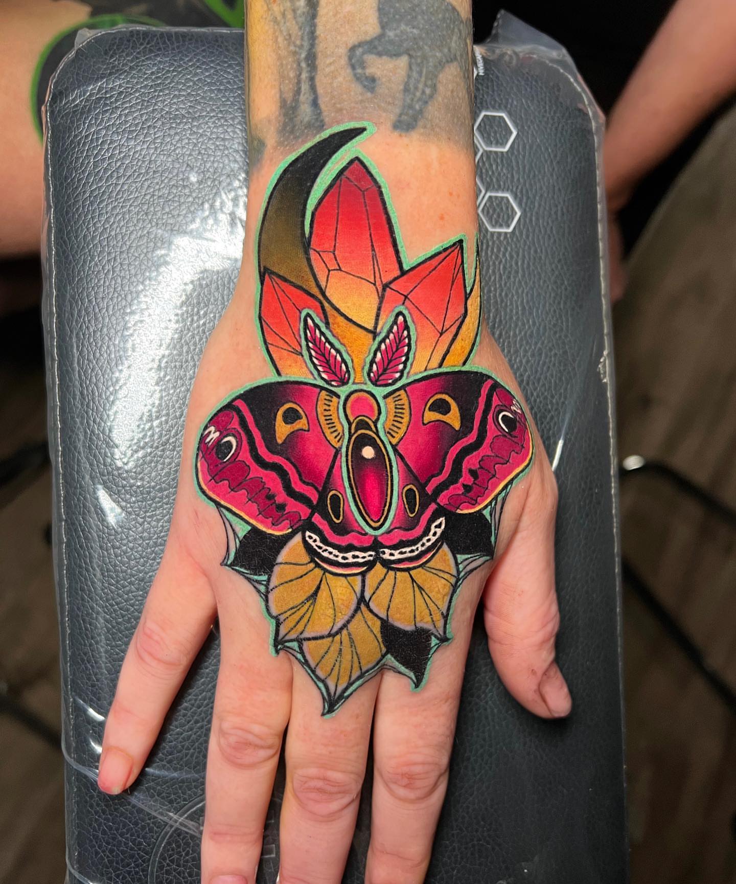 Butterfly American traditional tattoo on the hand by Brian Horowitz