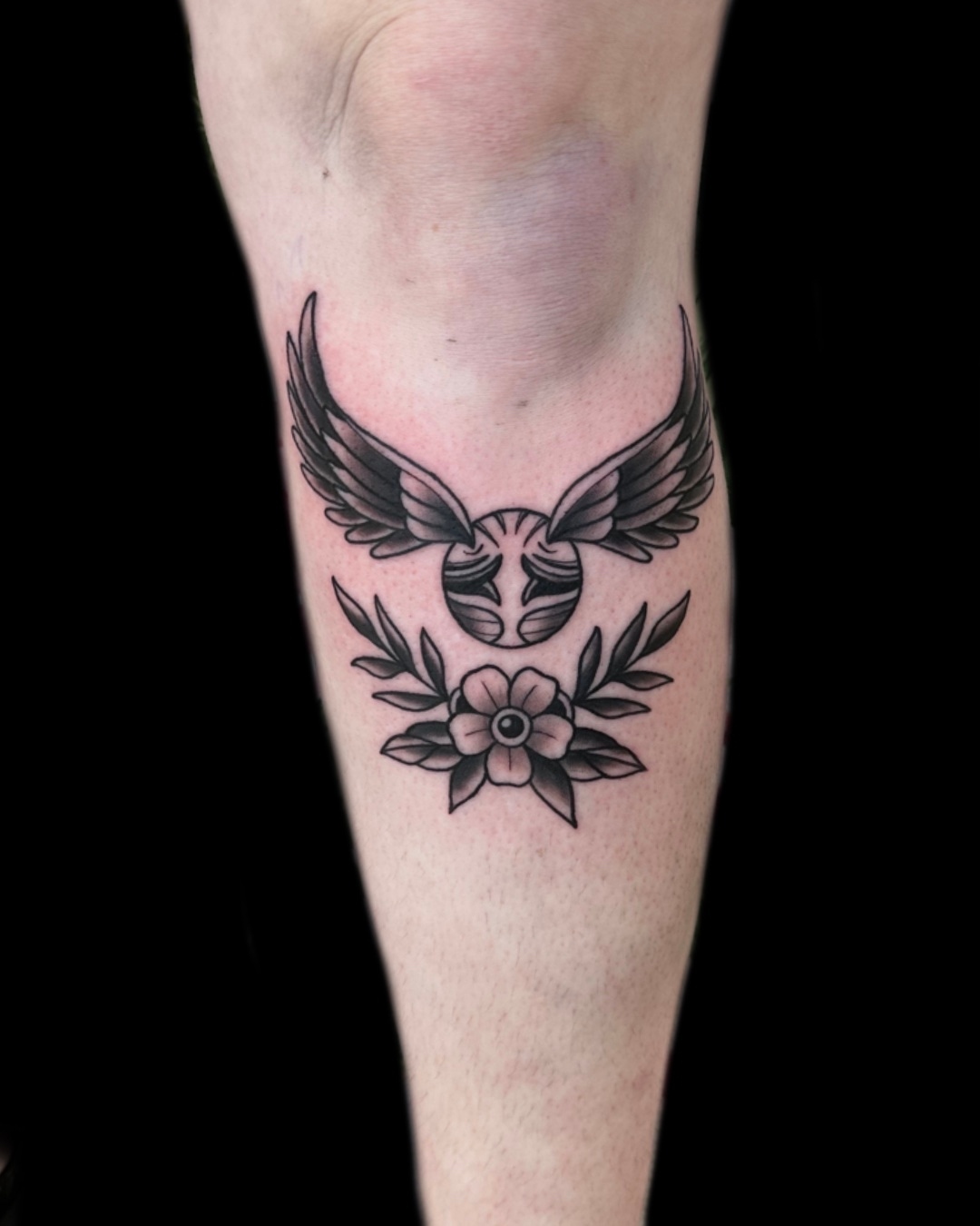 Wings and flower black and grey tattoo on the forearm by Blake Owens, Nashville, Tennessee
