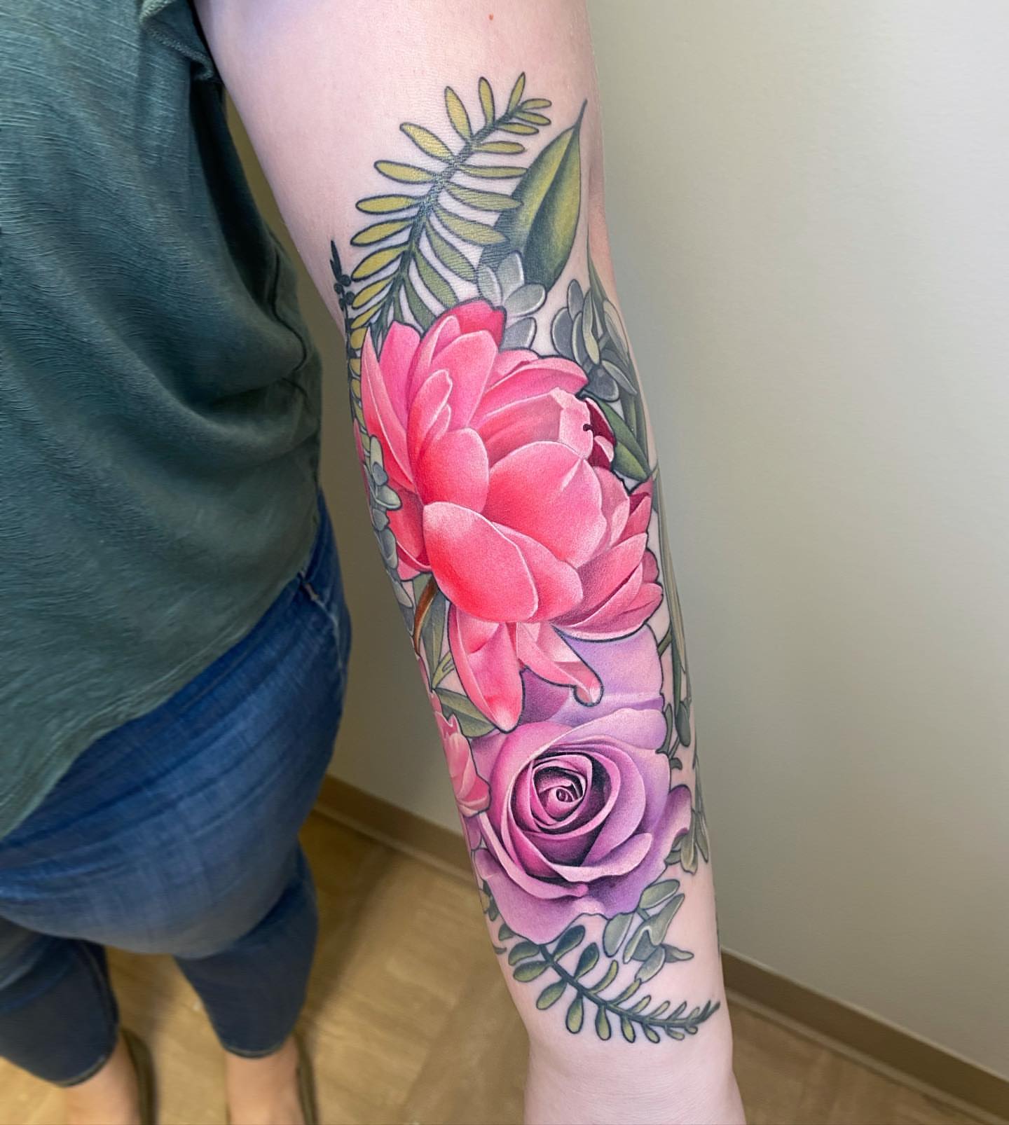 Floral bouquet realism tattoo on the forearm by Anali De Laney