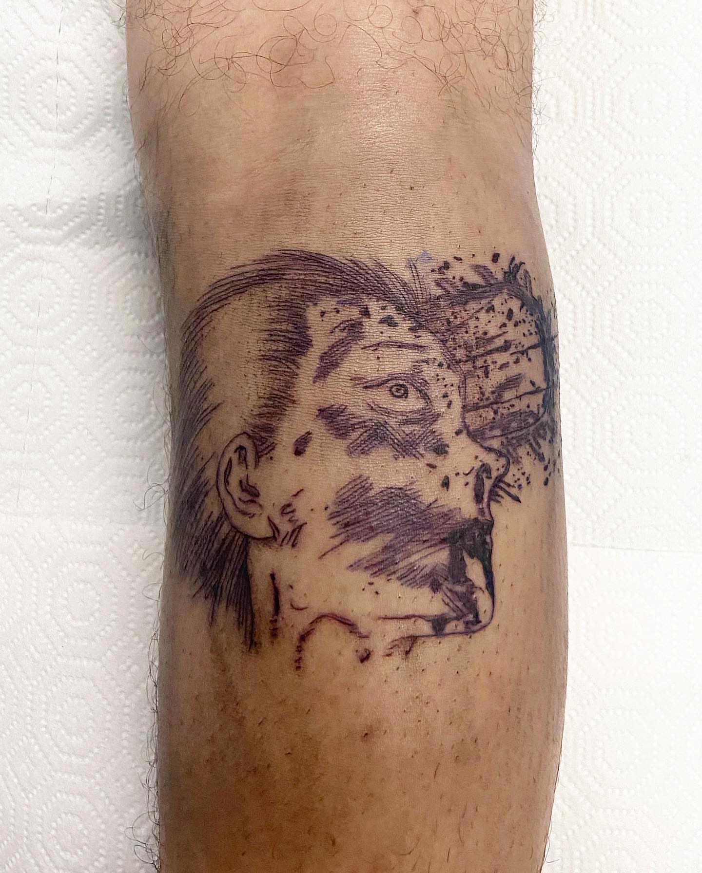Man's face realism tattoo on the forearm by Mika