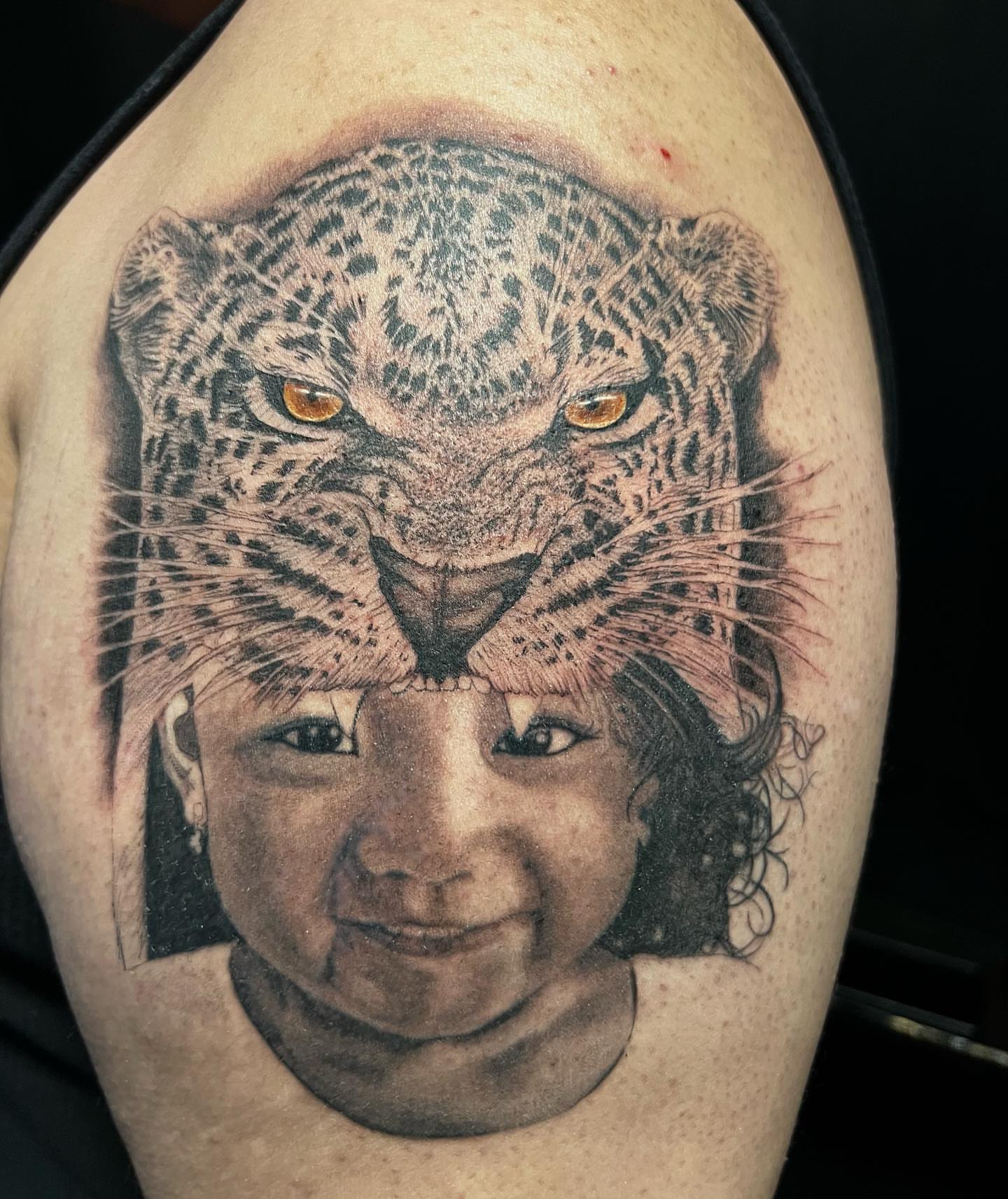 Child with leopard realism tattoo on the shoulder by JT Ink