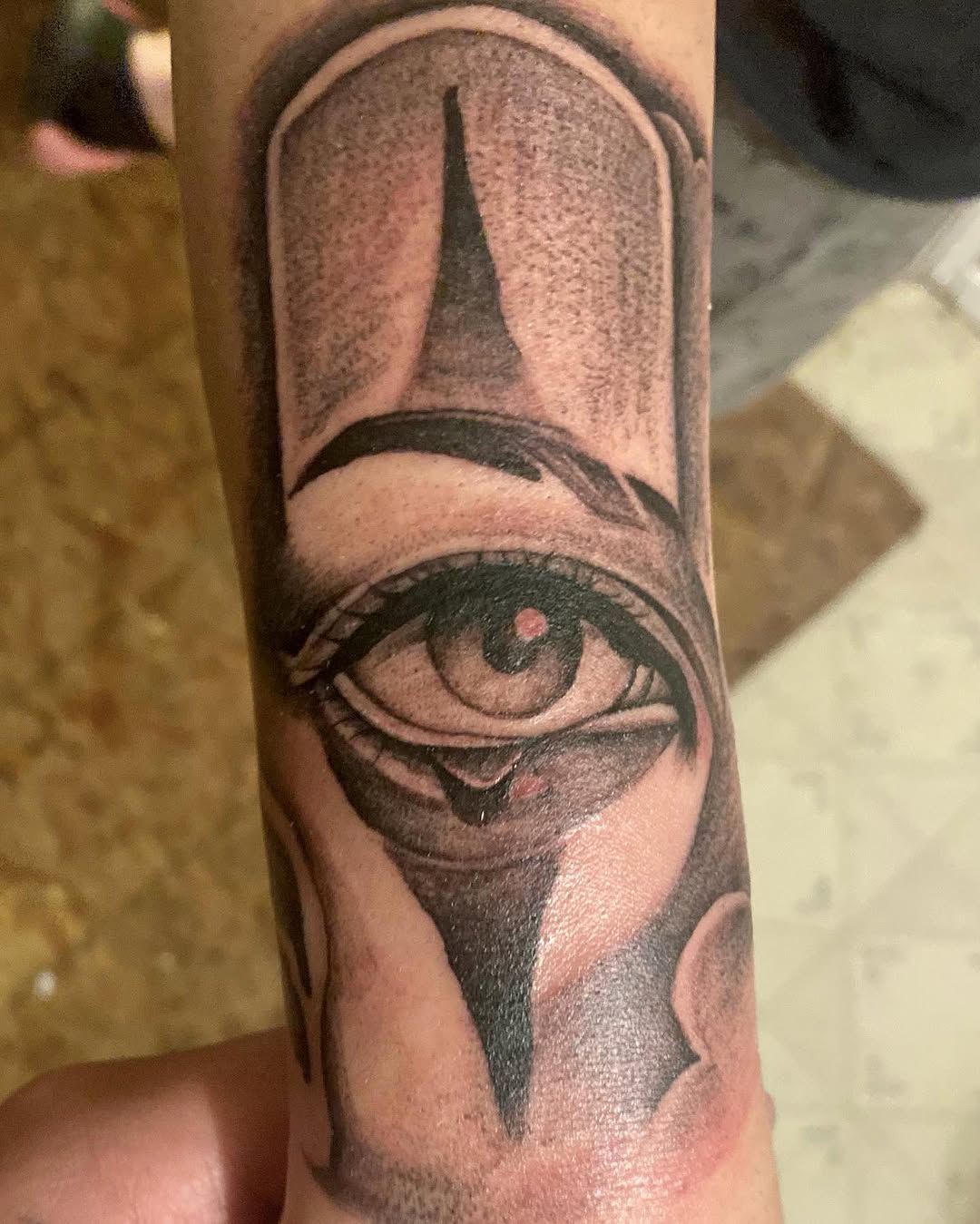 Eye with tear realism tattoo on the forearm by Ramirez Tattooing