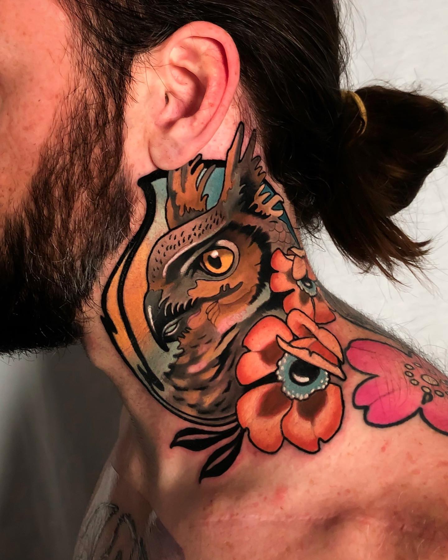 Owl and flowers American traditional tattoo on the neck by Milo Alfring Tattoo