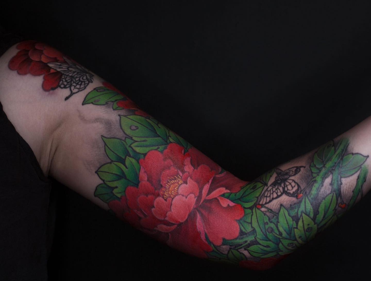 Peony flowers and butterflies American traditional tattoo on the forearm by Alice Li, Houston, Texas
