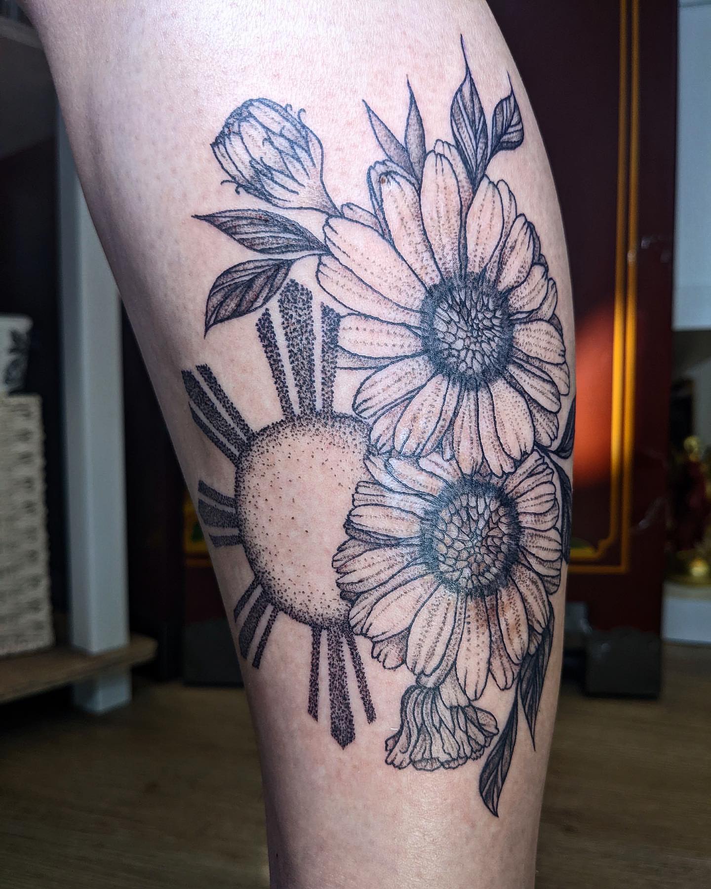 Sunflowers dotwork tattoo on the thigh by Aim 🤍