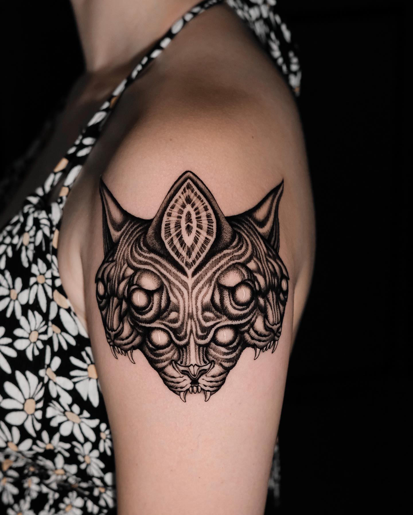 Cat head geometric tattoo on the thigh by Monkey Bob Tattoo
