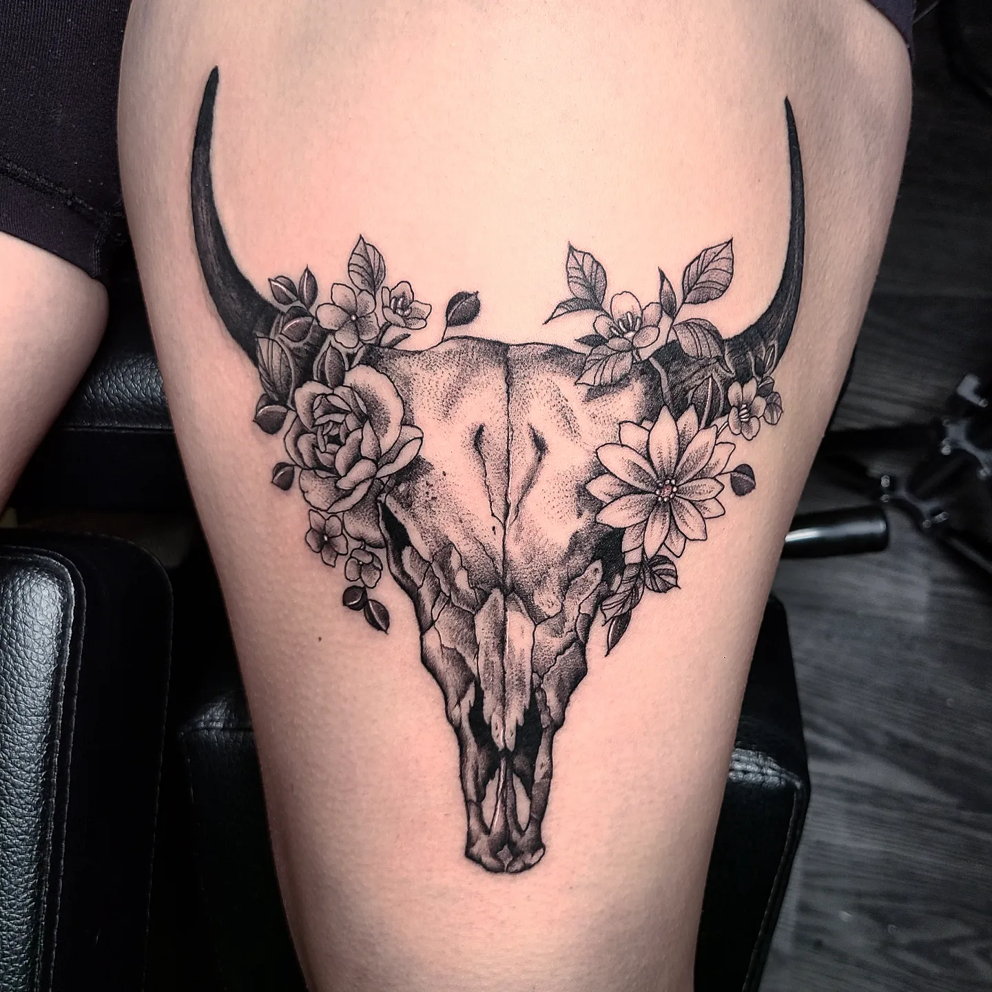 Bull skull with flowers dotwork tattoo on the thigh by Sydney Paige, Mentor, Ohio