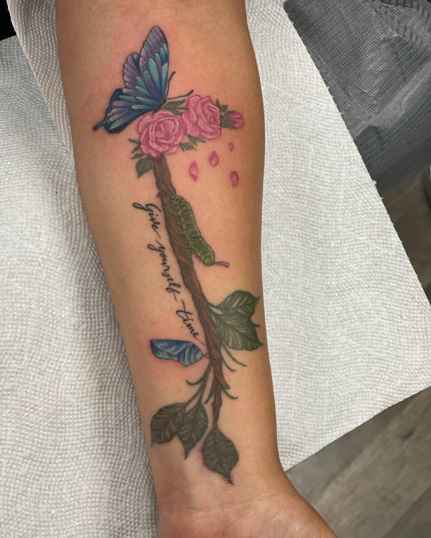 Butterfly and roses new school tattoo on the forearm by 𝕵𝖊𝖘𝖘𝖆 𝕭𝖎𝖌𝖊𝖑𝖔𝖜, Harrison, New Jersey