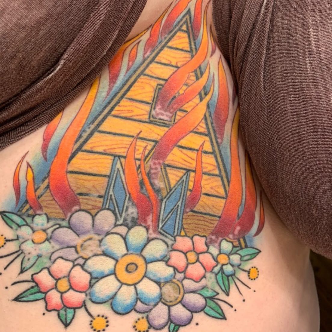 Pyramid with flames and flowers American traditional tattoo on the ribs by Jenni Hand - Tattoo, Maryville, Tennessee