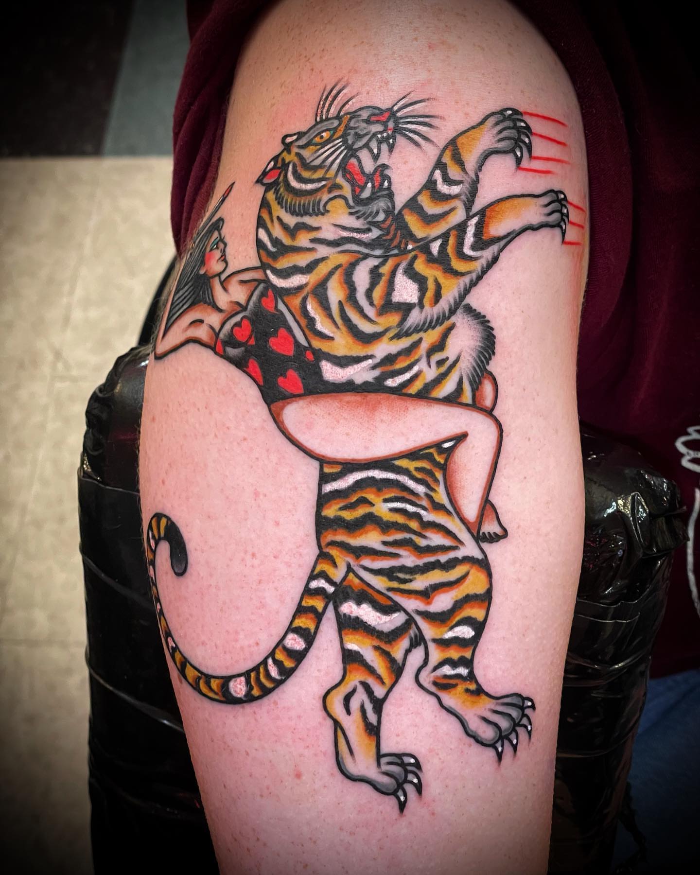 Tiger American traditional tattoo on the shoulder by Alex Muniz