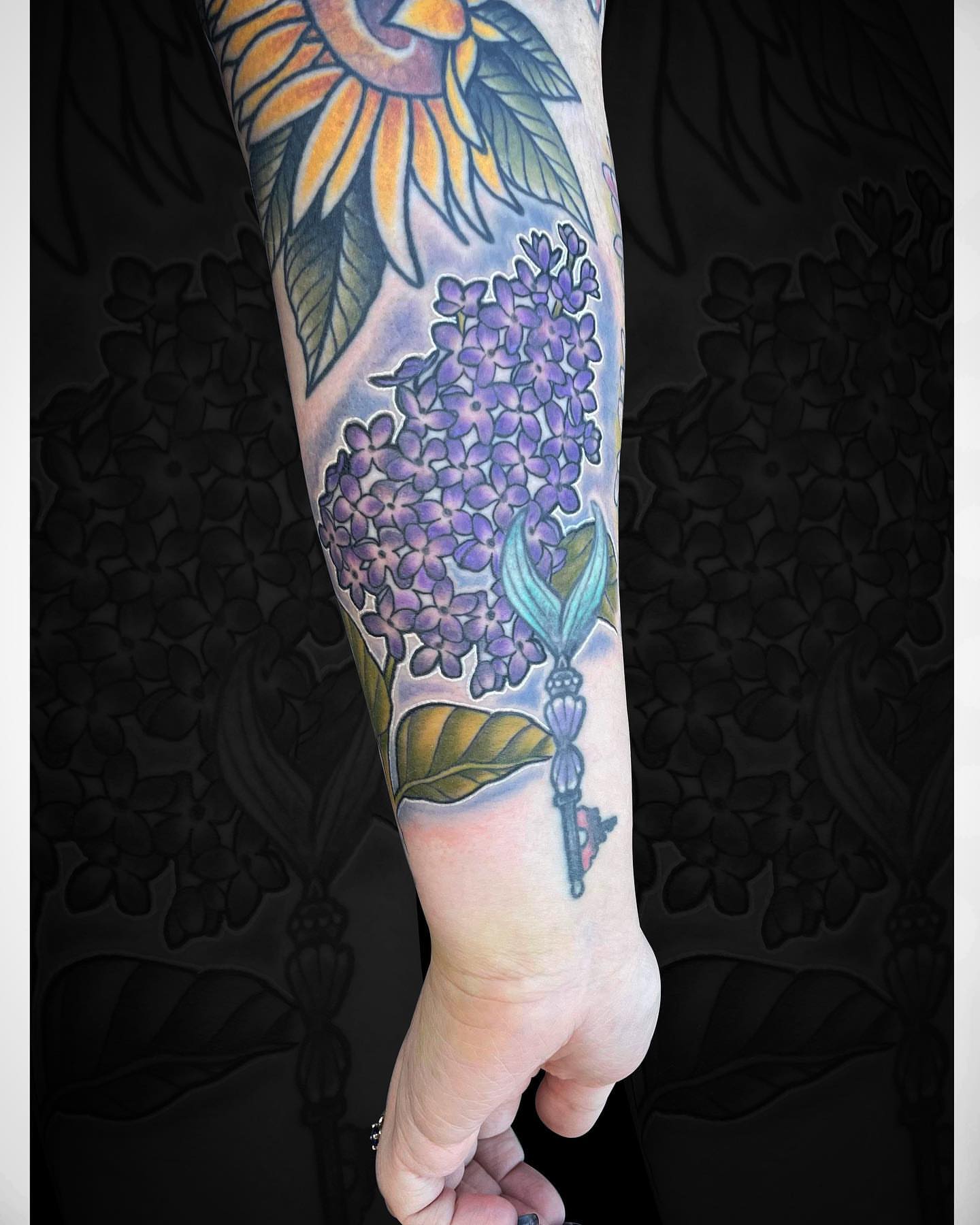 Sunflower and hydrangea realism tattoo on the forearm by Nick Harrison, Dayton, Ohio