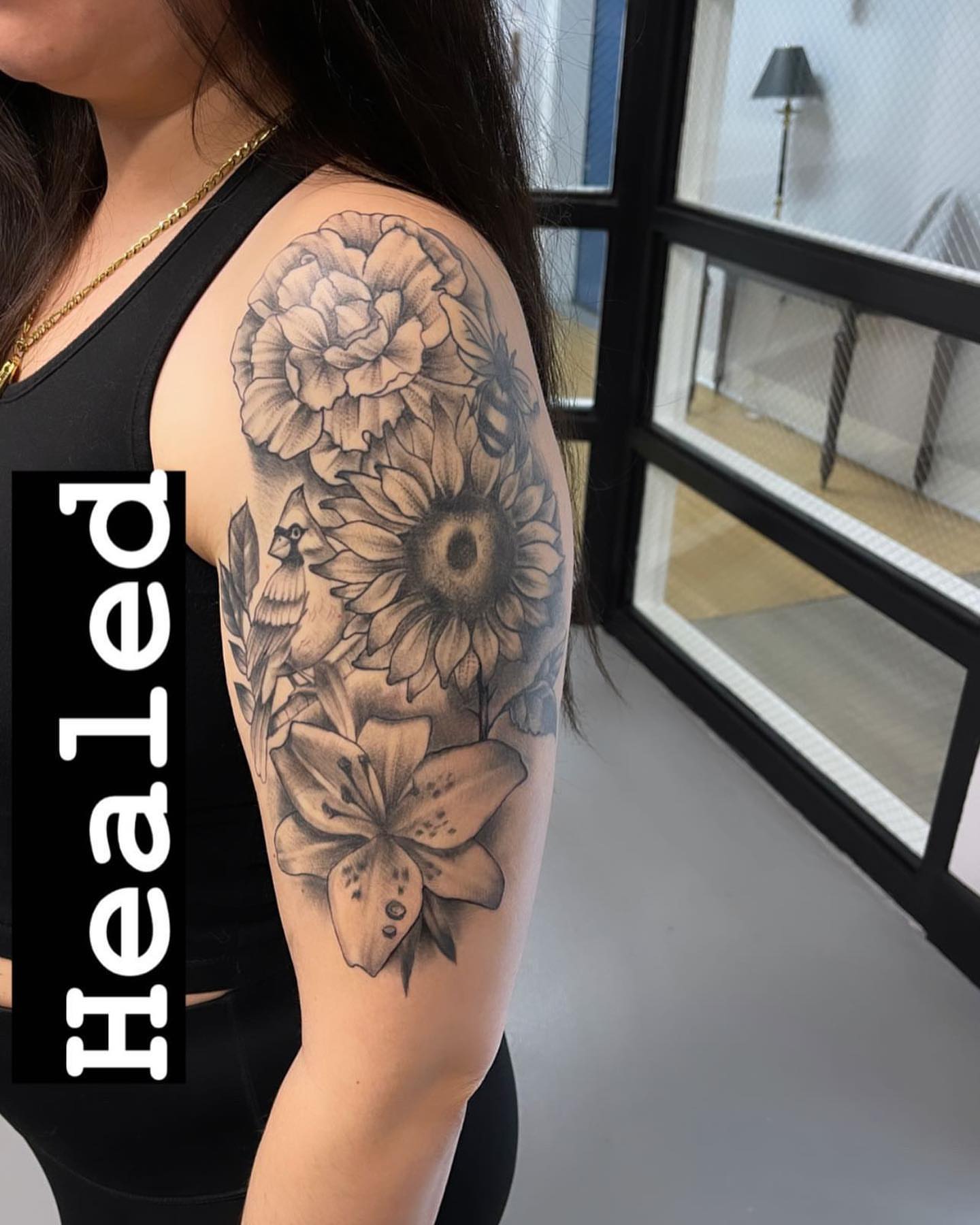 Sunflower and lily black and grey tattoo on the shoulder by Mikeyftsk2